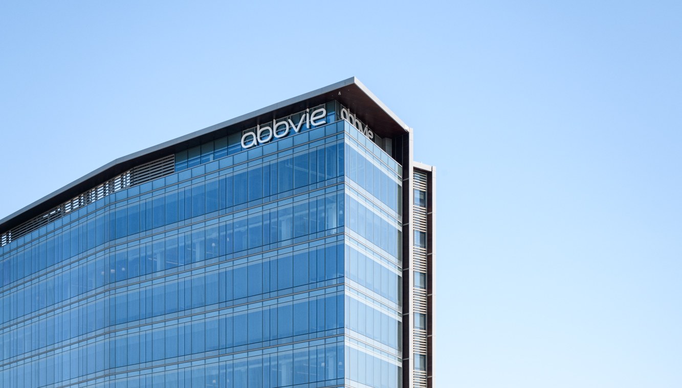 An AbbVie office tower with the AbbVie name on its roofline