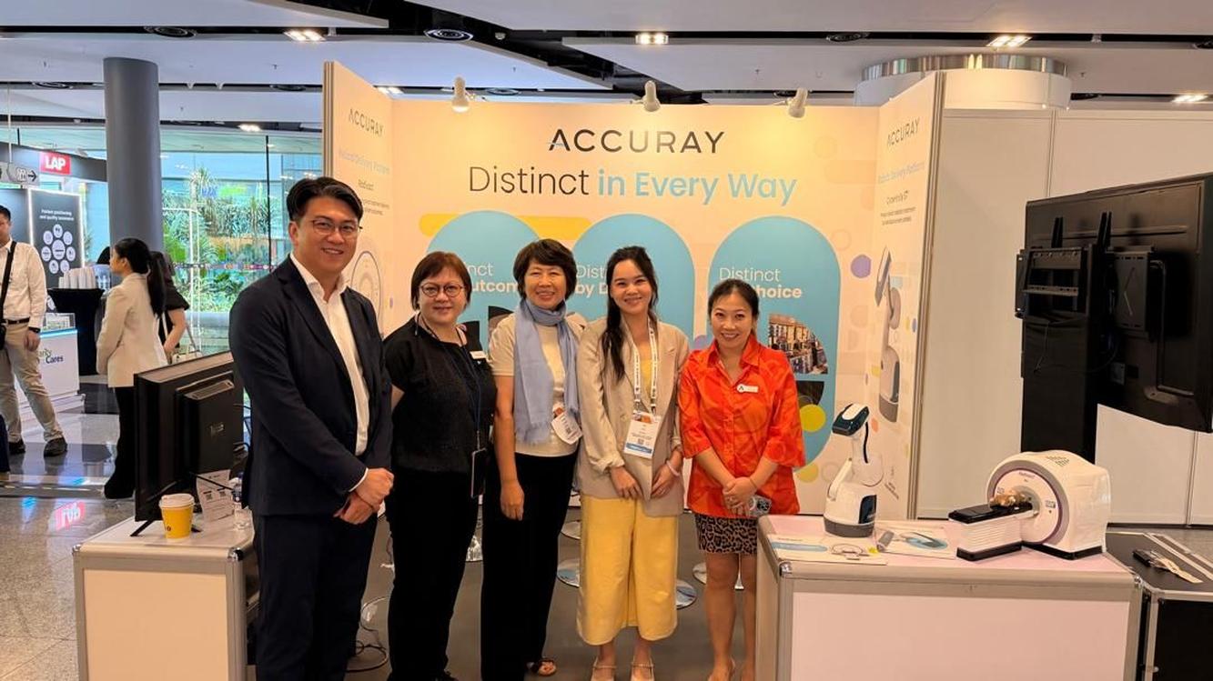 Accuray team and visitors gathered at its ESTRO Meets Asia exhibition booth