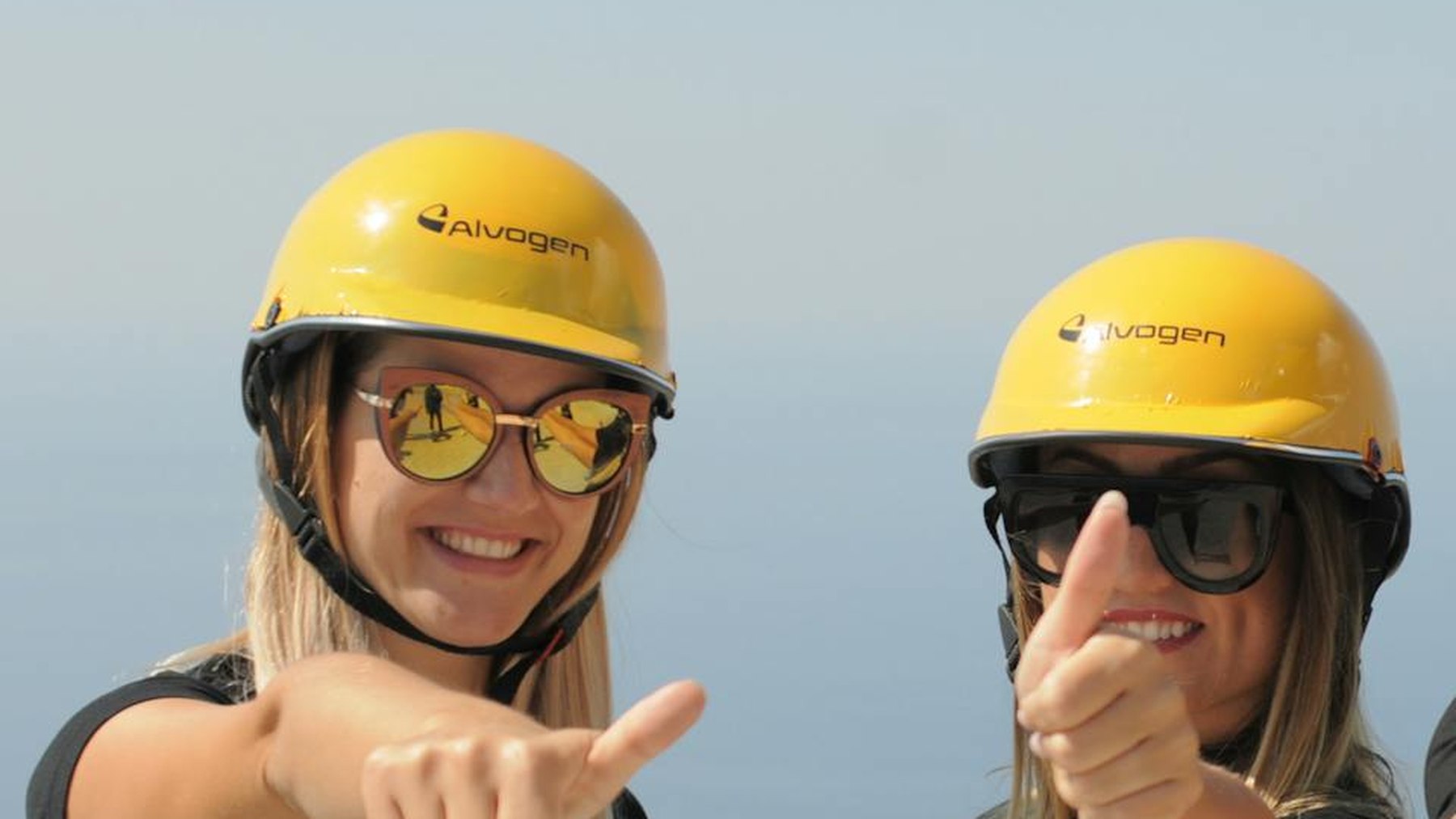Two Alvogen colleagues wearing hard hats and smiling at a company site