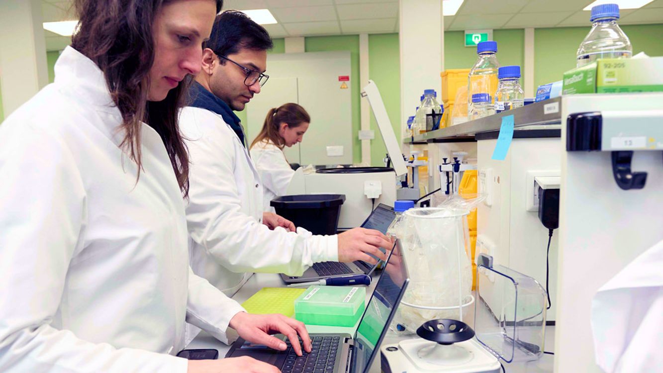 Argenx researchers working together at a laboratory bench