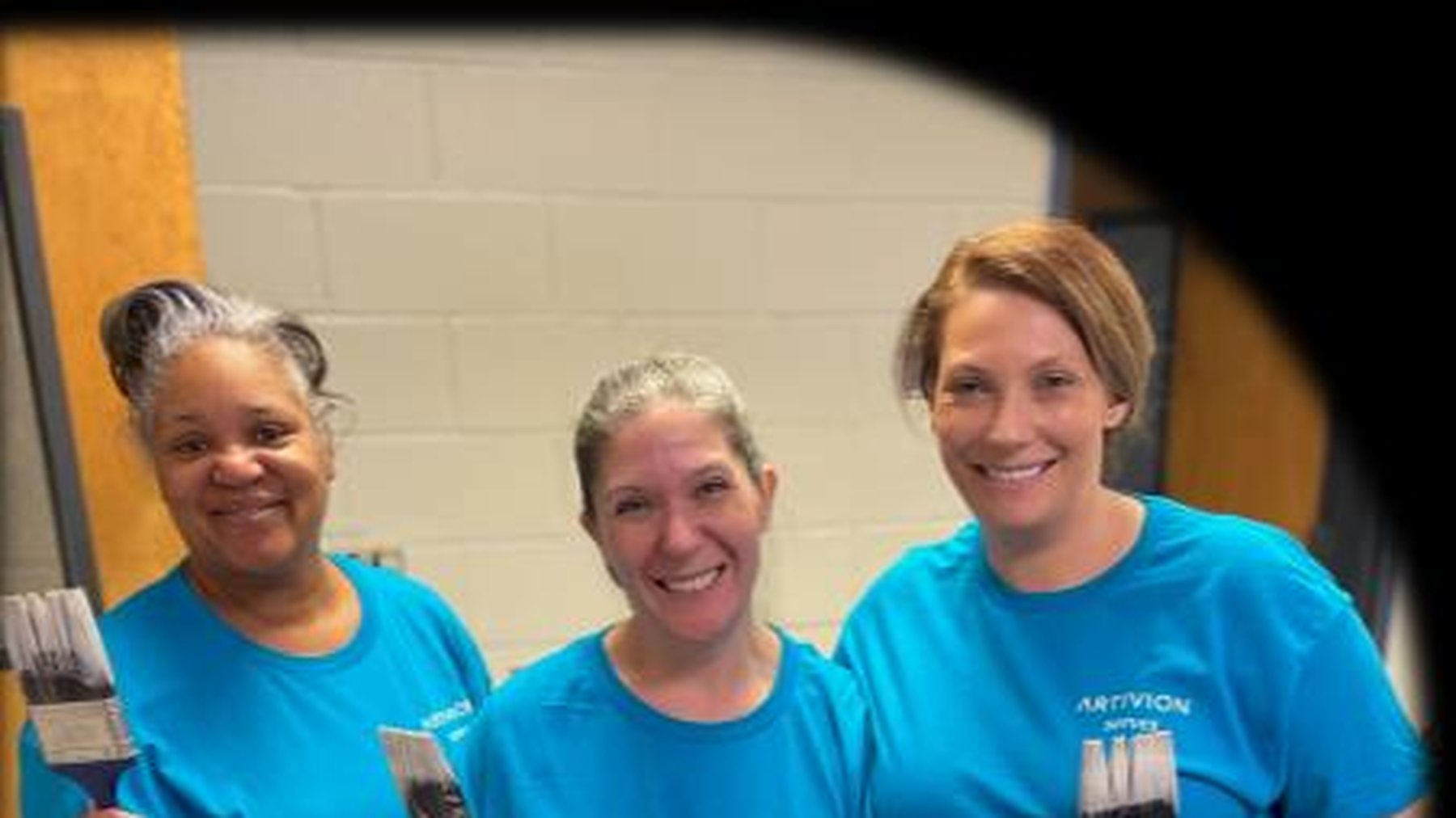 Artivion colleagues in matching blue shirts taking part in community service
