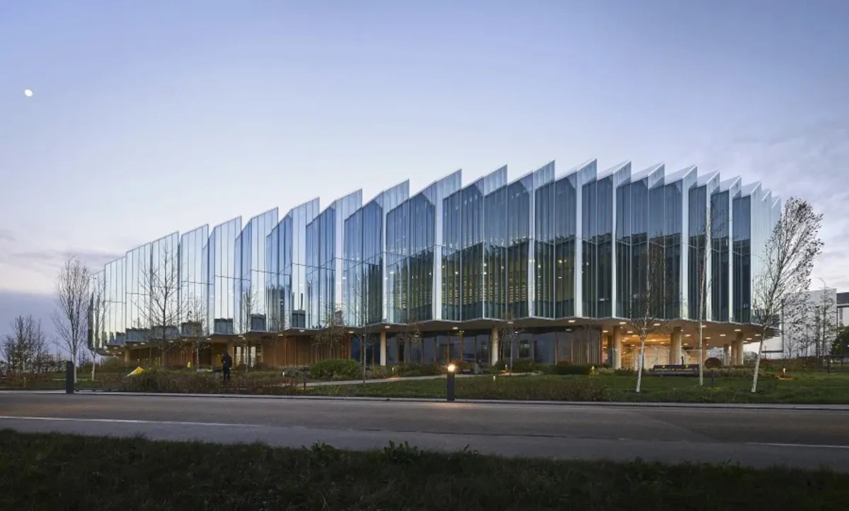 AstraZeneca's glass-fronted Discovery Centre in Cambridge at dusk