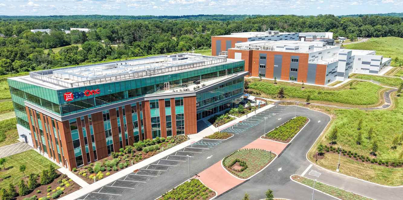 Aerial view of the BeOne Medicines campus in Hopewell, New Jersey, surrounded by green fields