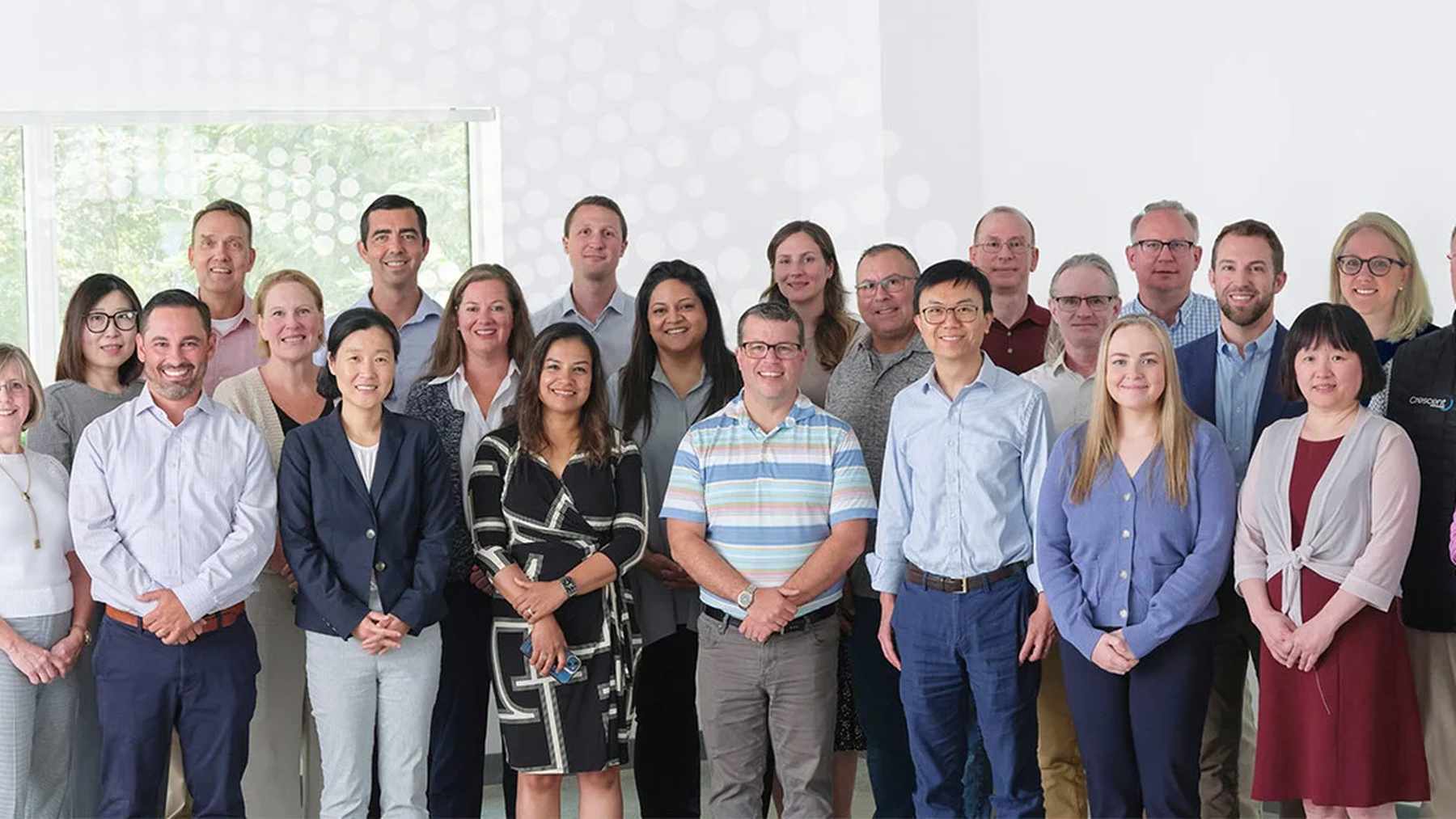 The Crescent Biopharma team standing together at the company office