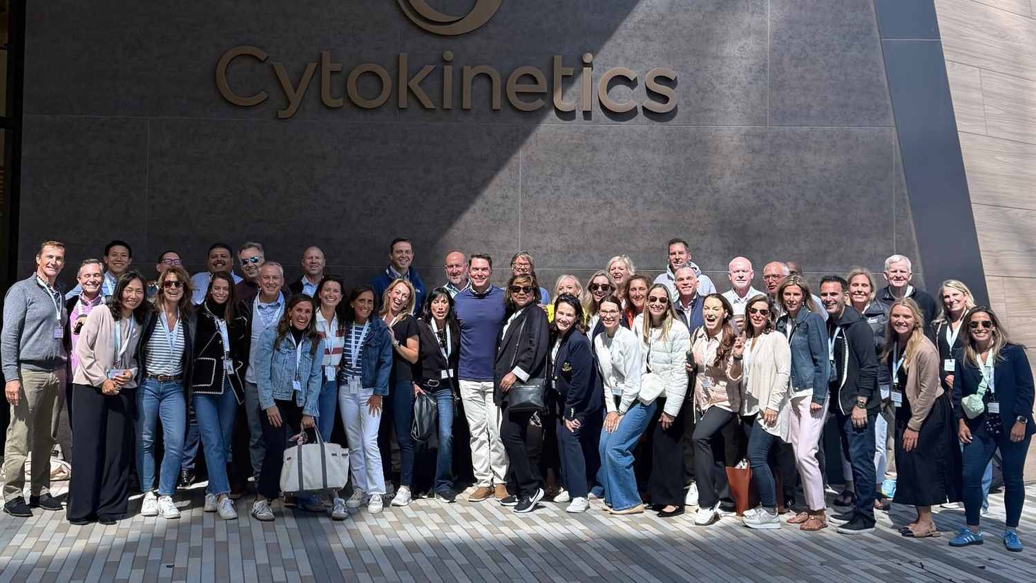 Cytokinetics' new cardiovascular account specialist team smiling in front of the company's headquarters sign