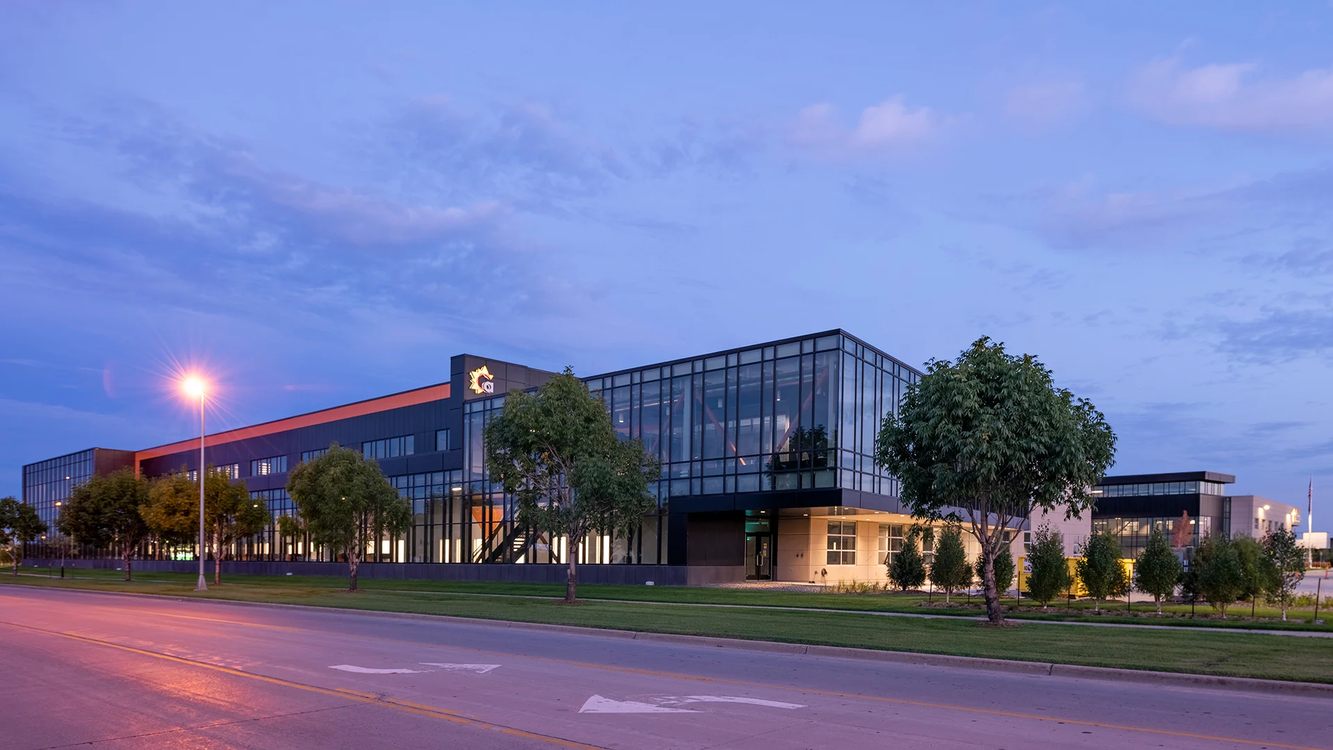 Aldevron's Breakthrough manufacturing campus in Fargo, North Dakota, lit up at dusk