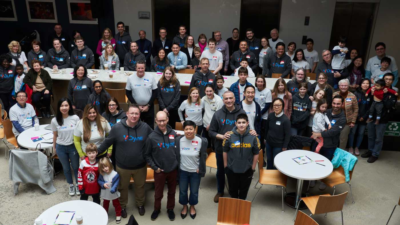 Dyne Therapeutics colleagues gathered together for a company team photograph
