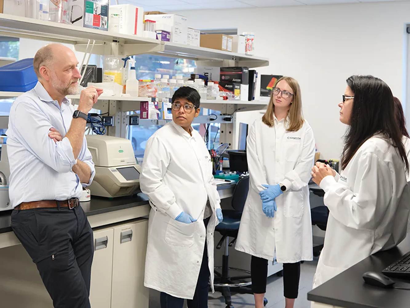 Edgewise colleagues discussing research together in a laboratory