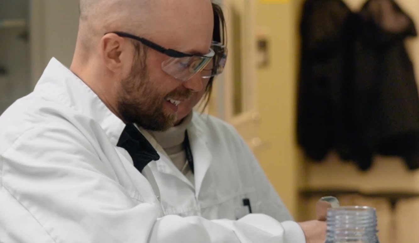A Galderma laboratory colleague working with samples