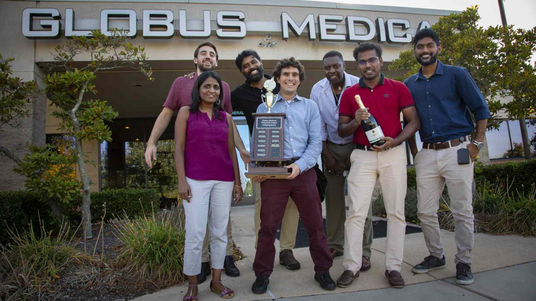 Globus Medical colleagues standing together outside a company building