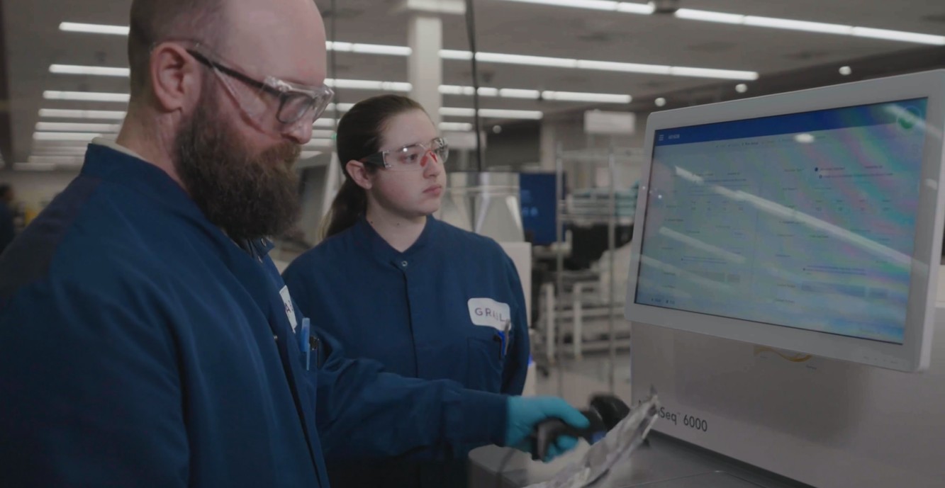 Two GRAIL laboratory colleagues reviewing equipment and data