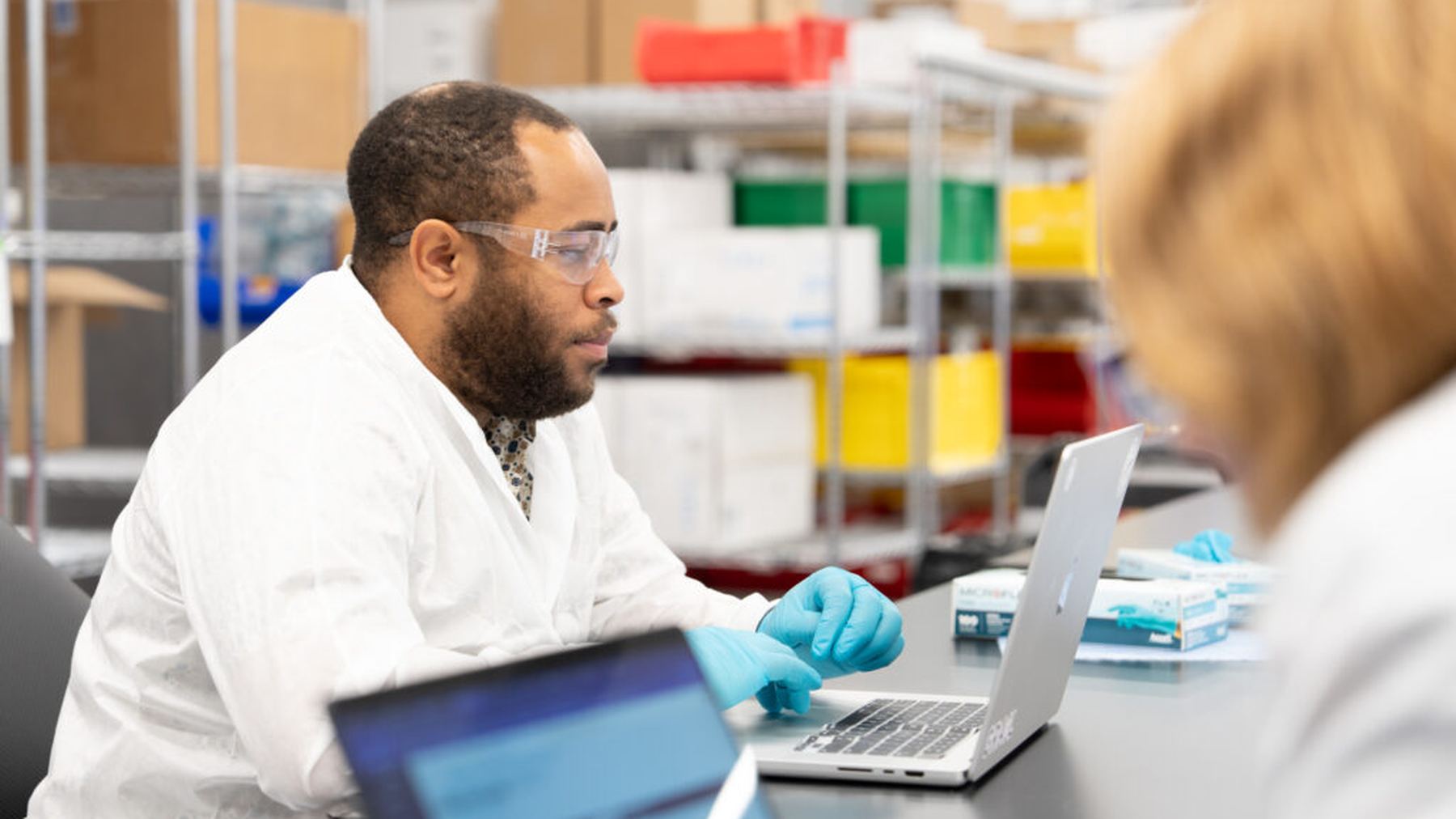 GRAIL scientists collaborating at a laboratory table