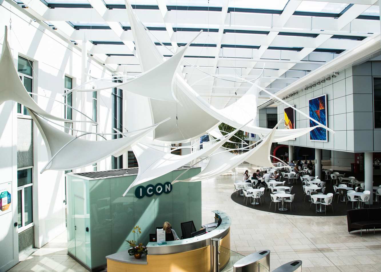 The reception desk and bright atrium at ICON's Dublin headquarters, with the ICON name on the wall