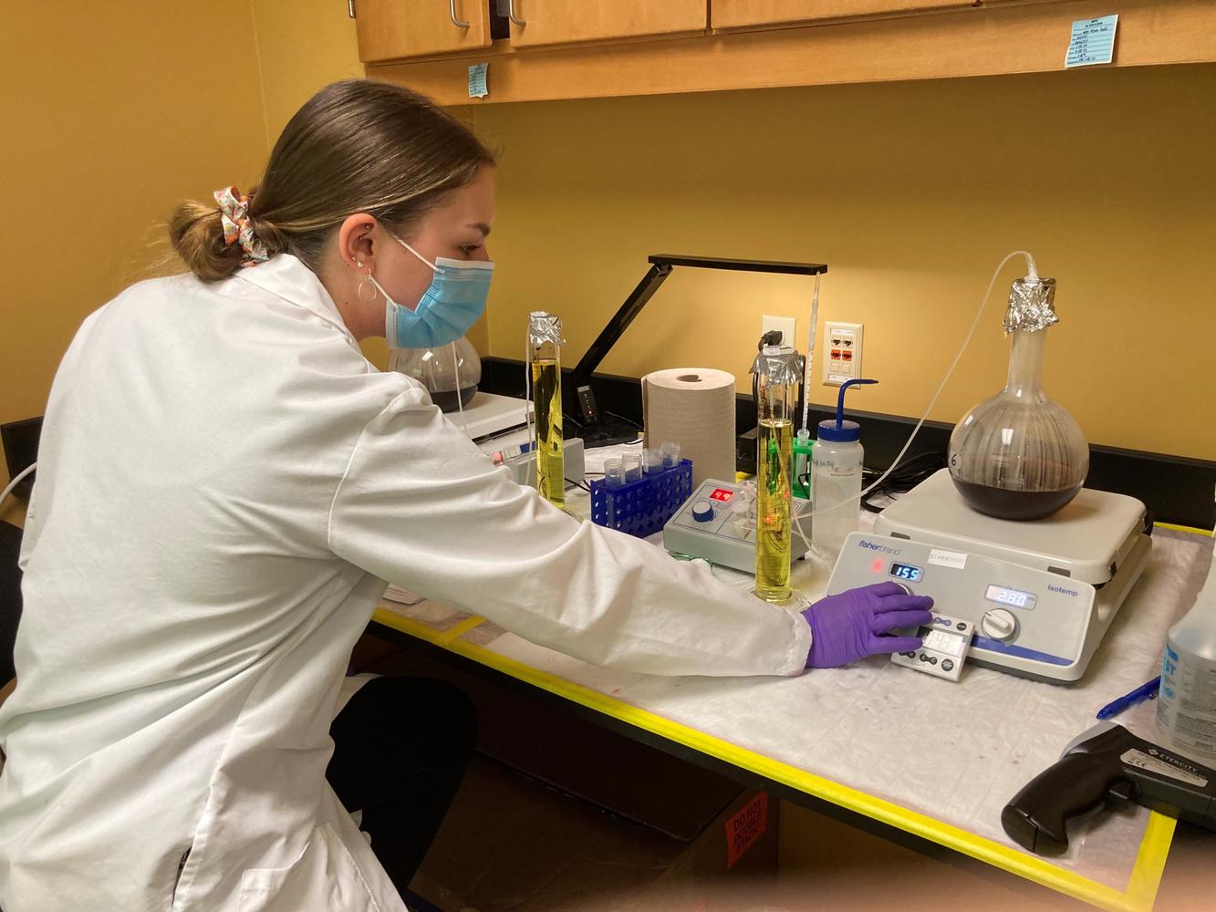 An InBios scientist preparing diagnostic work at a laboratory bench