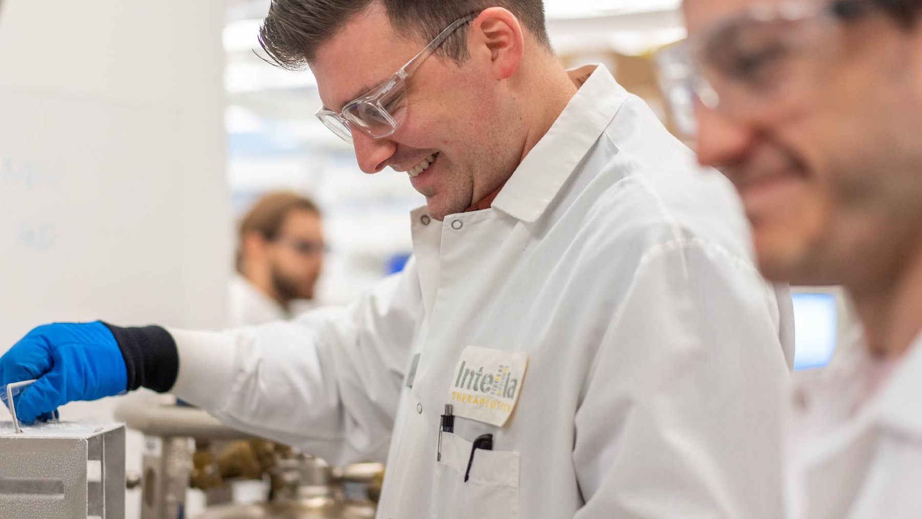 Two Intellia researchers working together at a laboratory bench