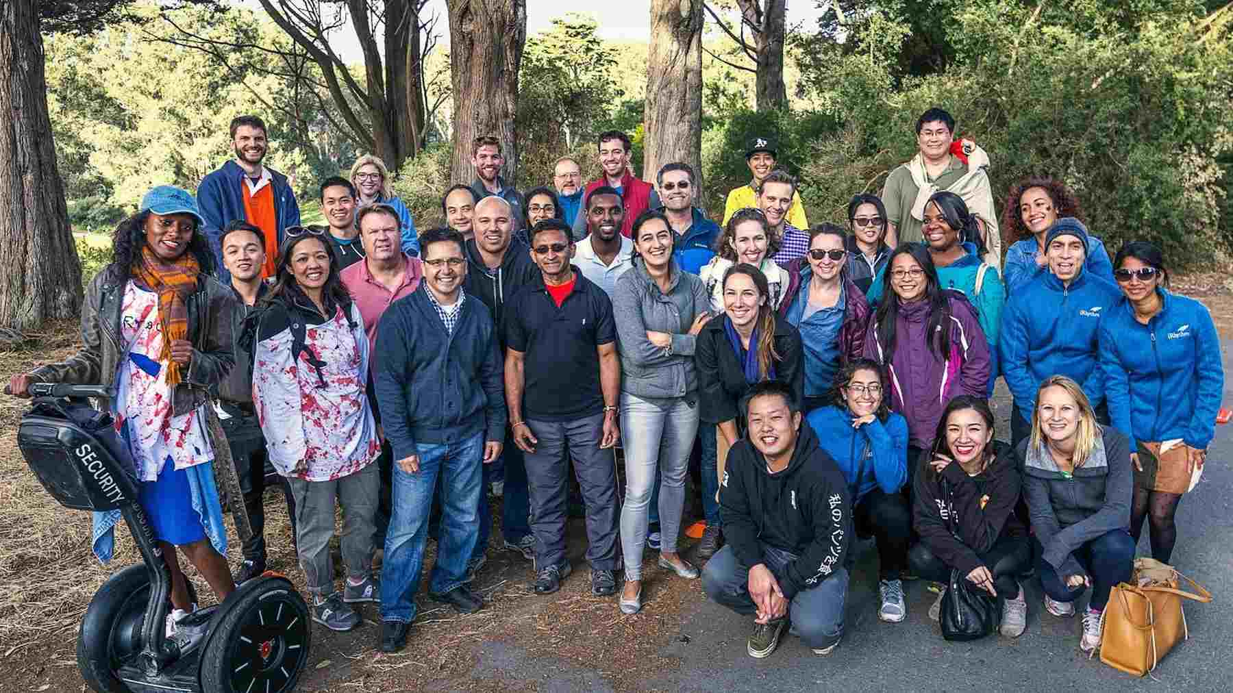 A large group of iRhythm colleagues smiling together during a team outing