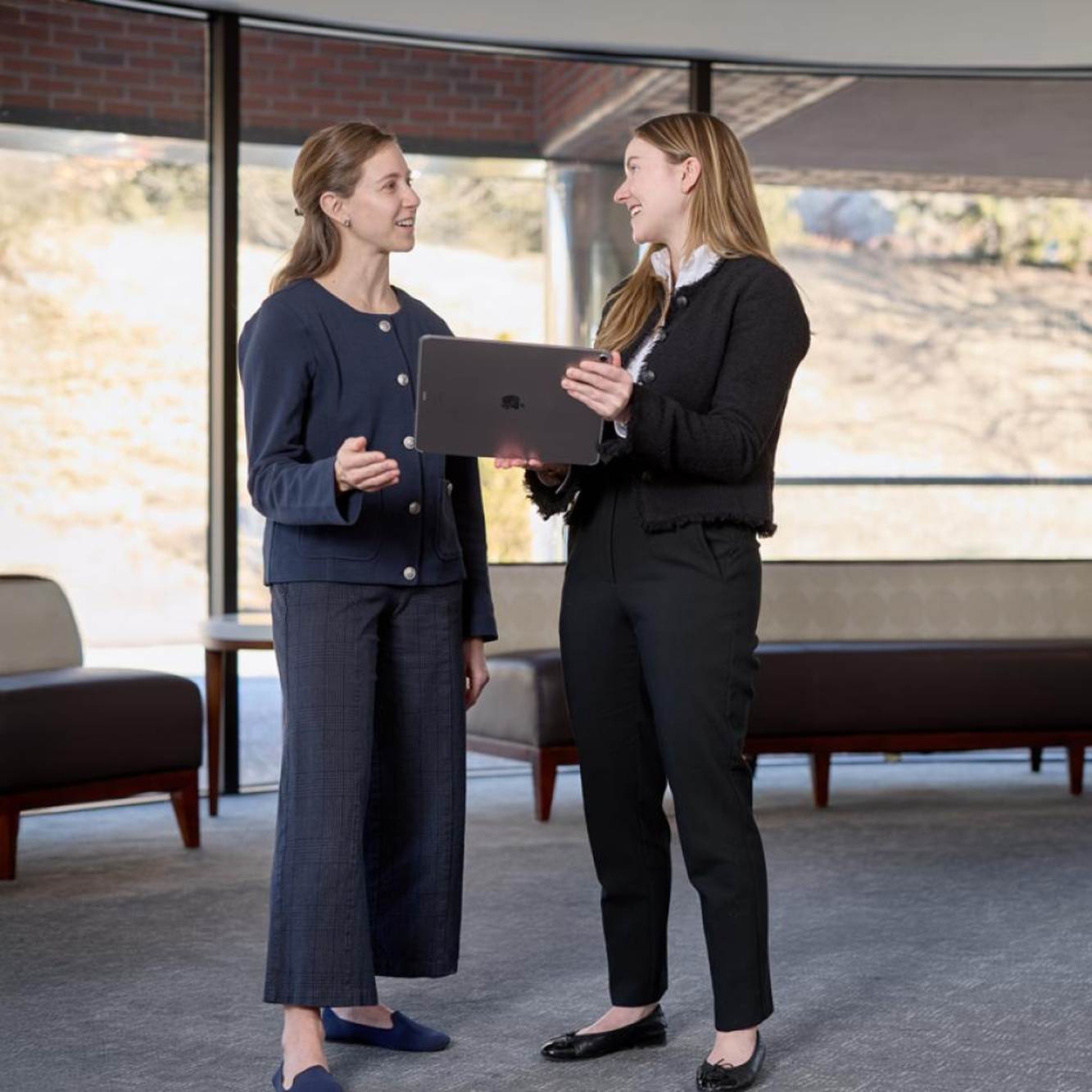 Two Kiniksa colleagues discussing their work together