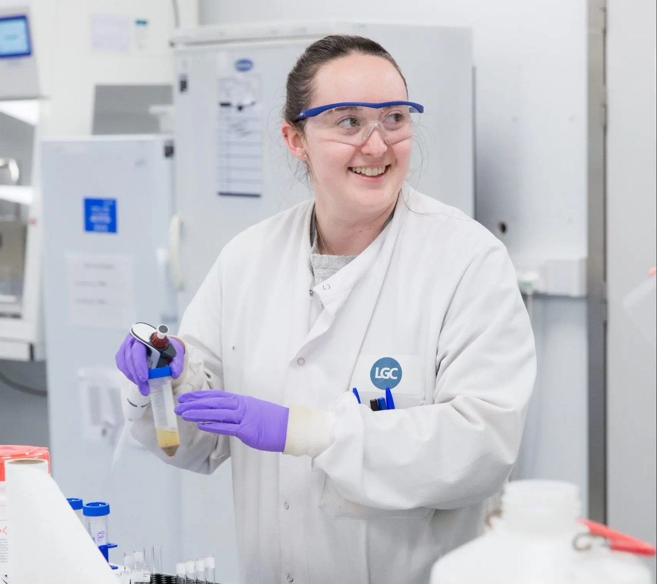 LGC scientist handling samples in a laboratory