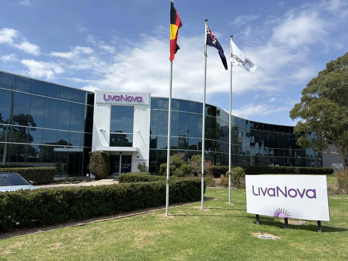 LivaNova facility with company signage and flags outside