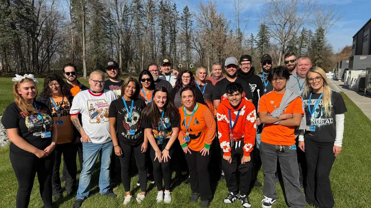 LSI Solutions employees gathered outdoors at a team event