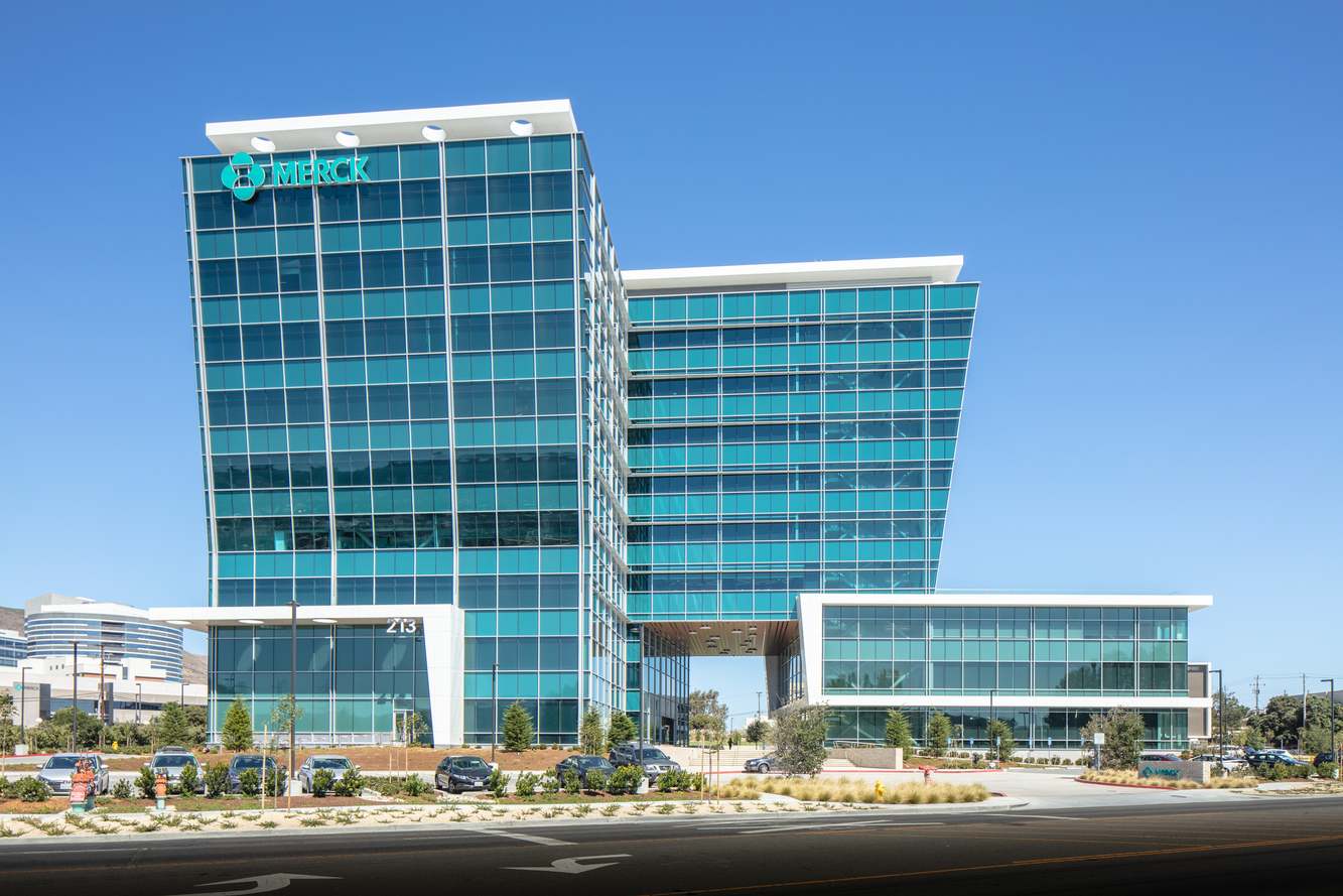 Merck's glass office tower in South San Francisco with the Merck name on its roofline