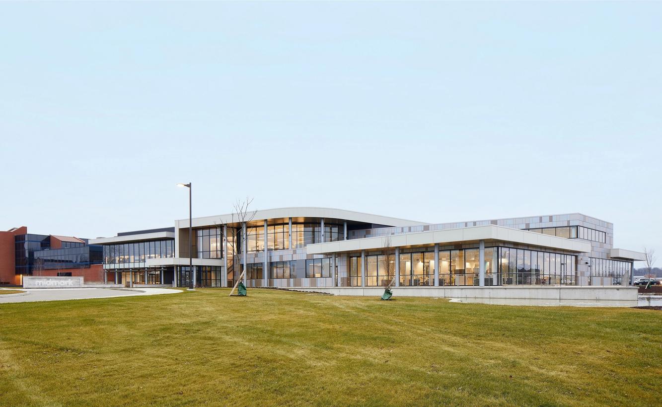 Midmark’s Versailles campus with glass-fronted buildings and a lawn
