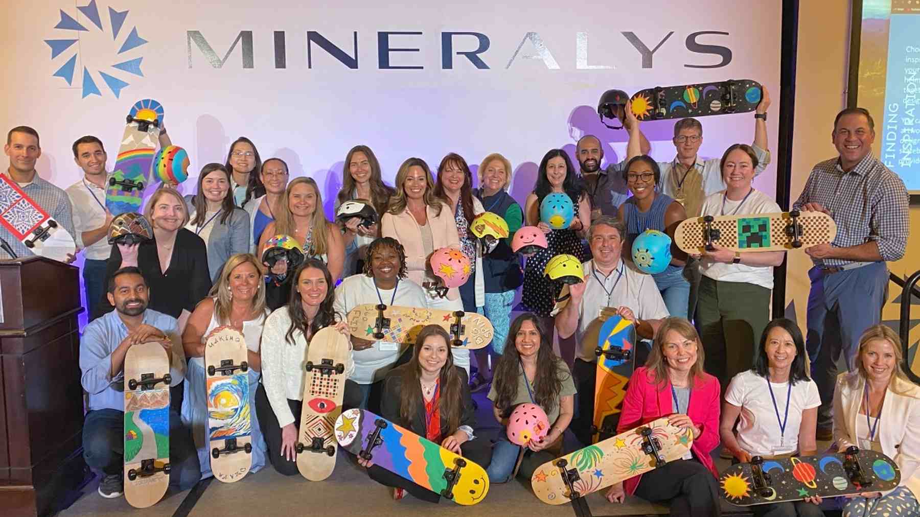 Mineralys colleagues showing the skateboards they created at a team volunteer event