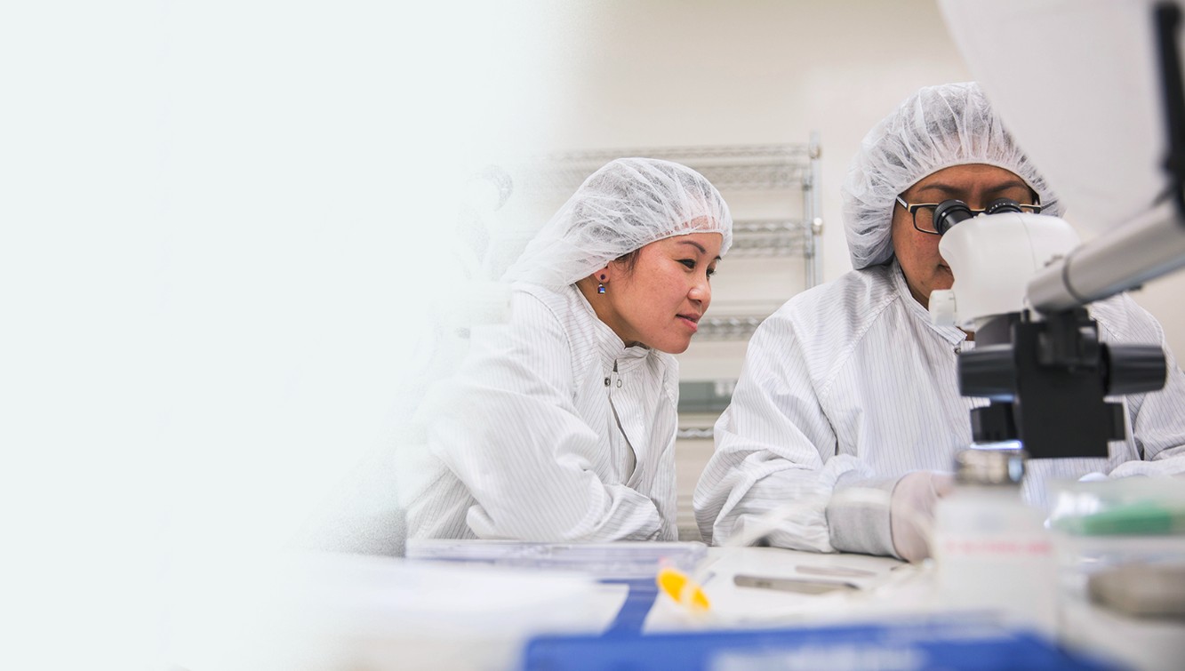 NeuroPace technical colleagues working together with laboratory equipment