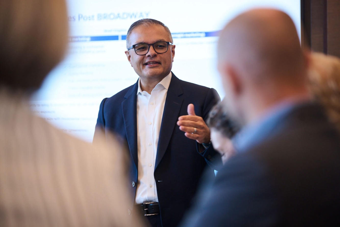 A NewAmsterdam Pharma leader presenting cardiovascular research to colleagues