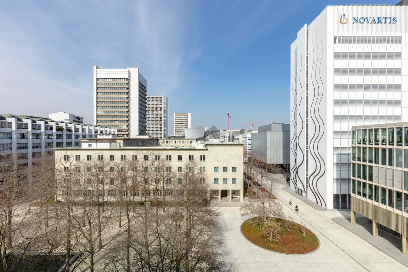 The Novartis Campus in Basel, with the Novartis name on the white Banting 1 tower