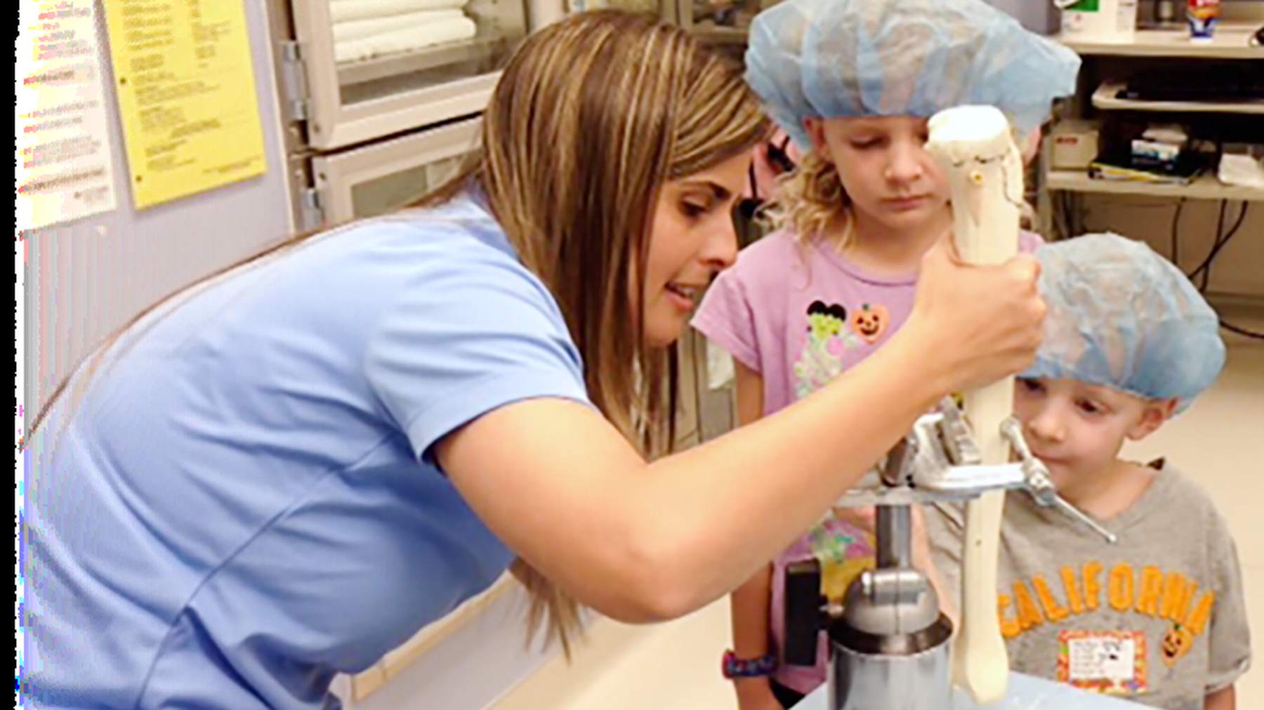 An OrthoPediatrics demonstration introduces children to orthopedic instruments