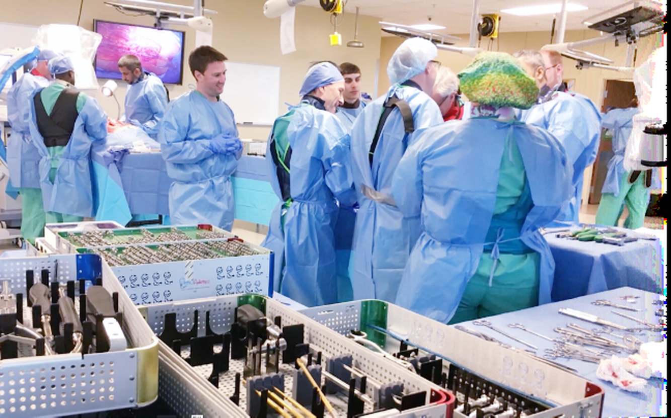 Clinicians watching an OrthoPediatrics surgical instrumentation demonstration