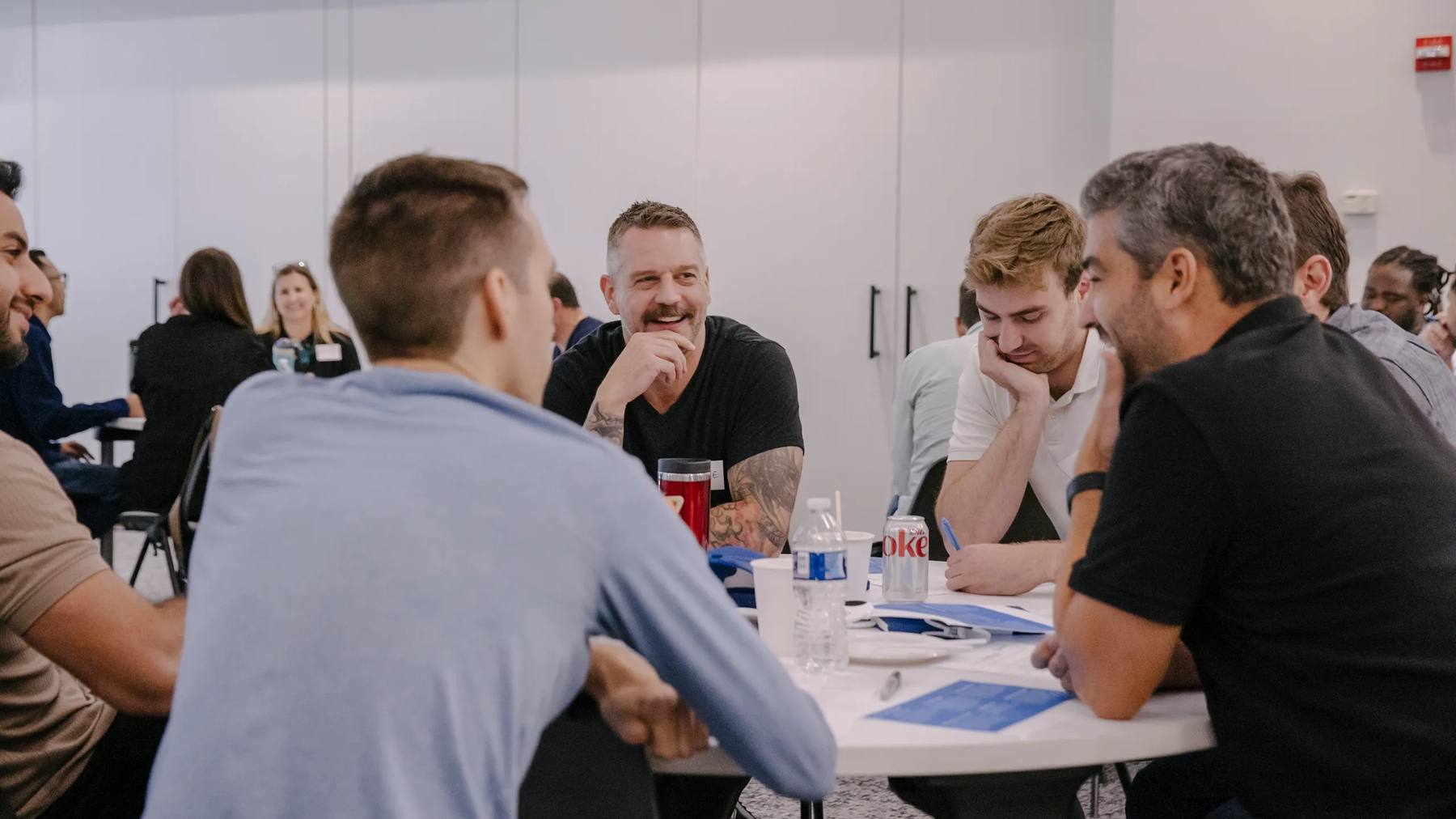 Prolaio colleagues discussing their work around an office table