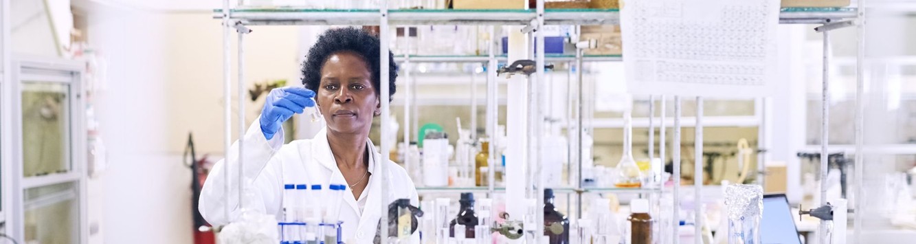 A Quest Diagnostics laboratory technician examining a sample in the laboratory
