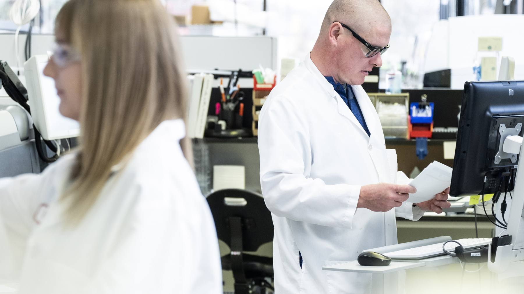 QuidelOrtho colleagues working together in a diagnostic laboratory