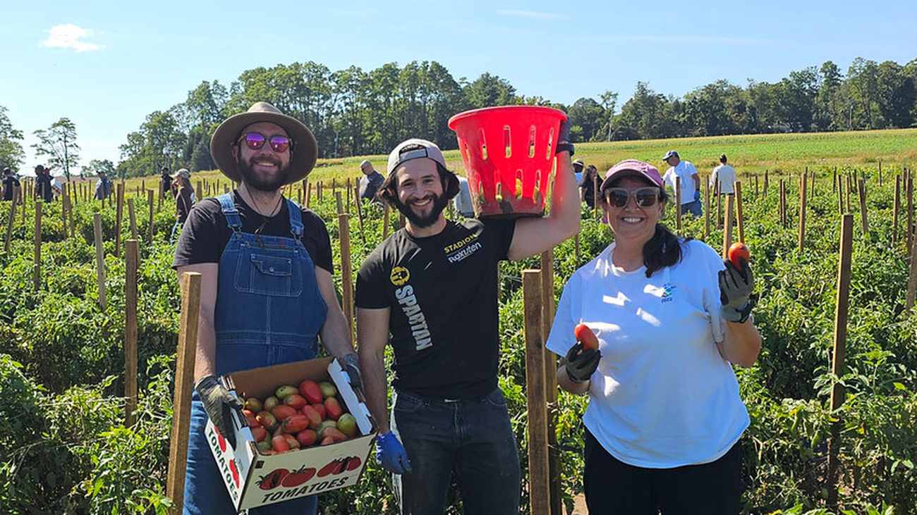 Three Repligen colleagues volunteering together in a community garden