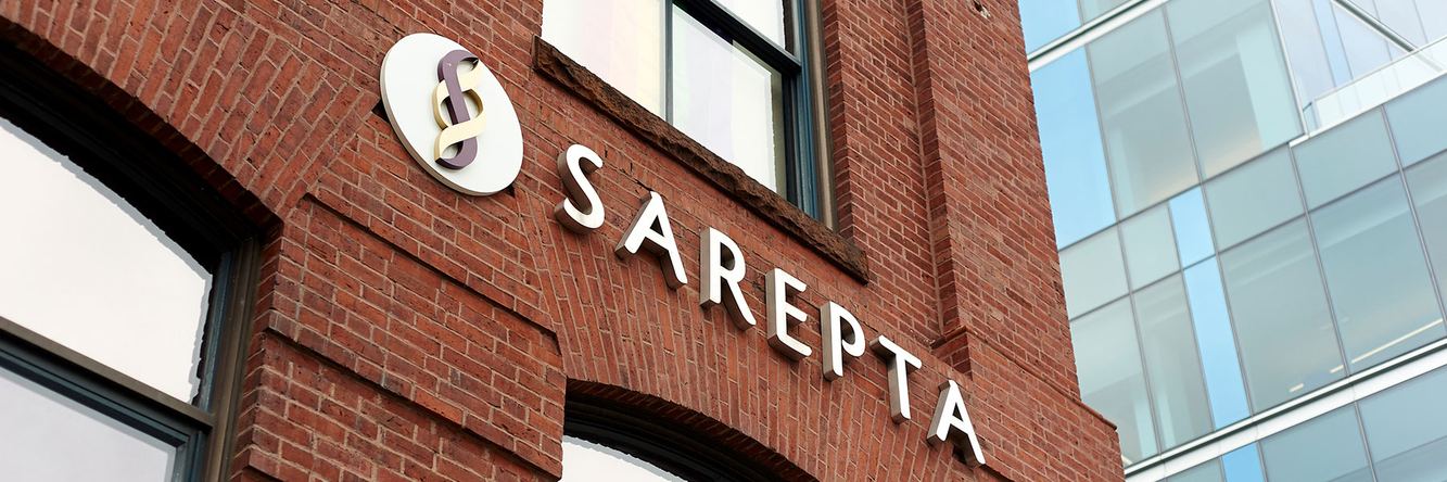 Sarepta’s name mounted on the brick facade of a company building