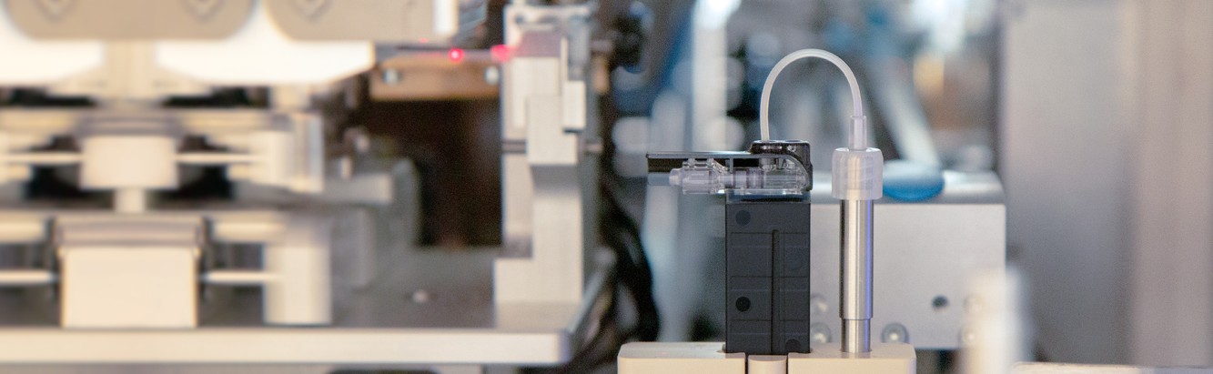 A Tandem Diabetes Care employee manufacturing an insulin pump