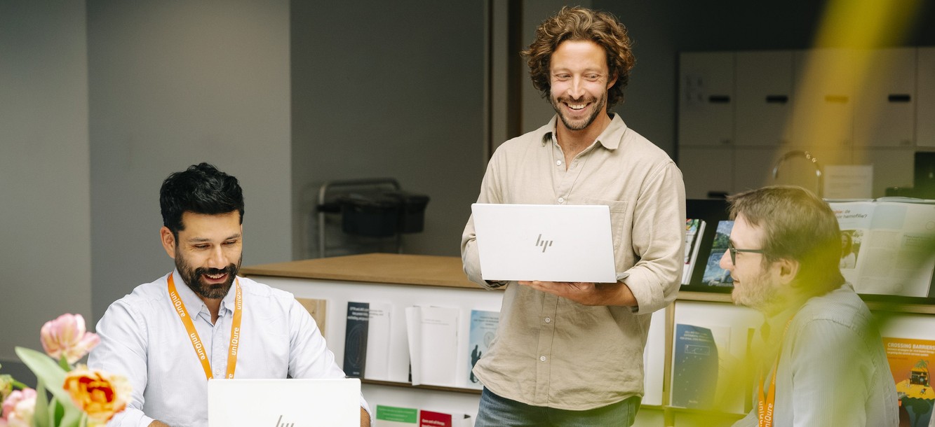 uniQure colleagues reviewing research together at a laboratory bench