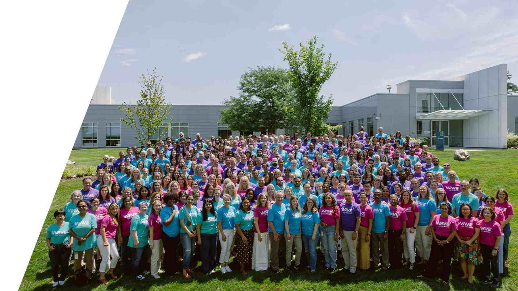 Wave Life Sciences employees gathered outside a company facility