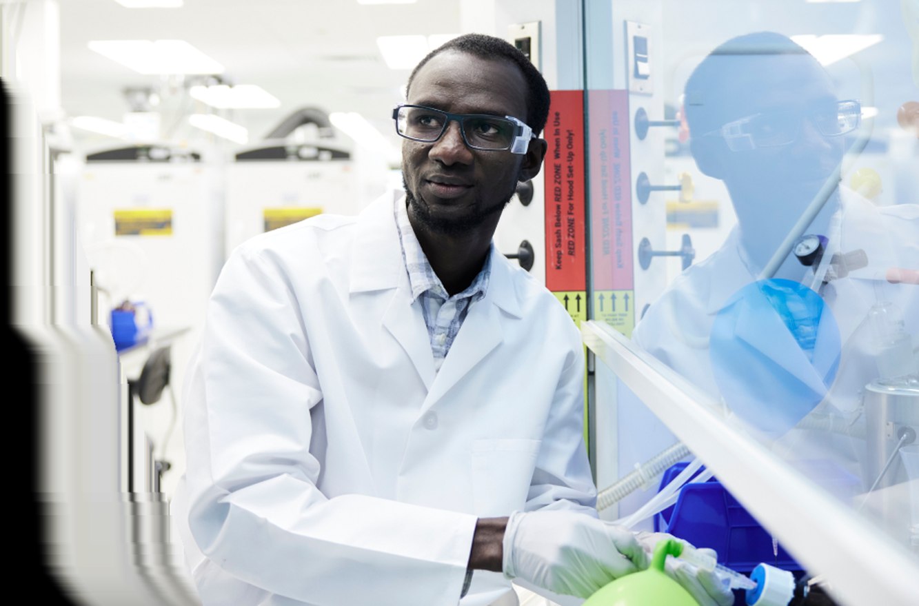 A Wave Life Sciences scientist working at a laboratory bench